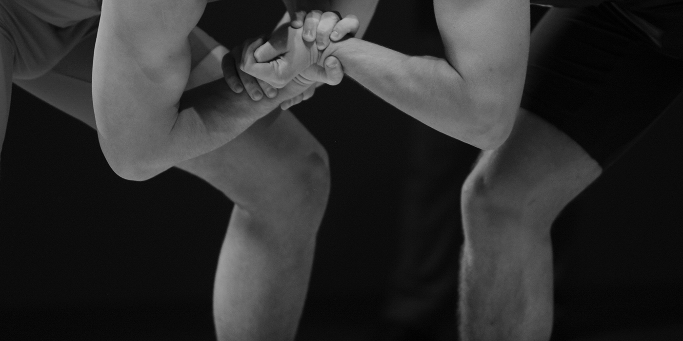 Two wrestlers Greco-Roman wrestling during competition