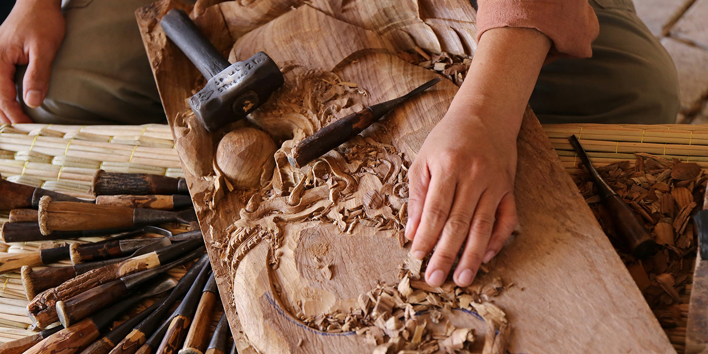 craftsman carving wood